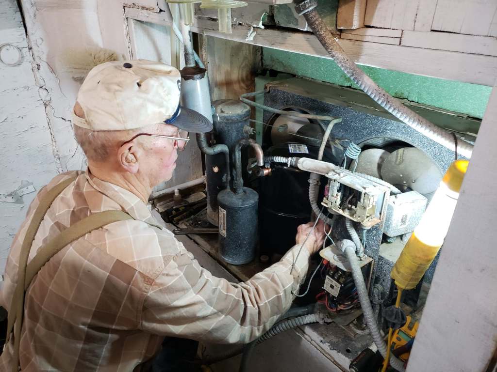Teddy Marshall working on a dairy farm. 